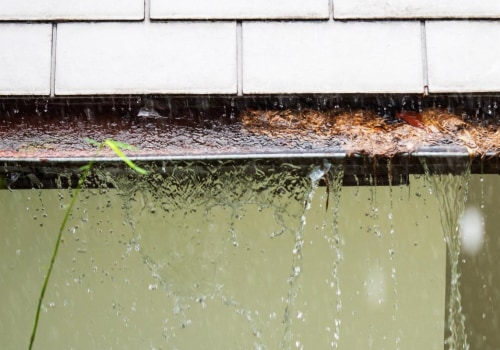 What is a common reason for water overflowing a gutter?